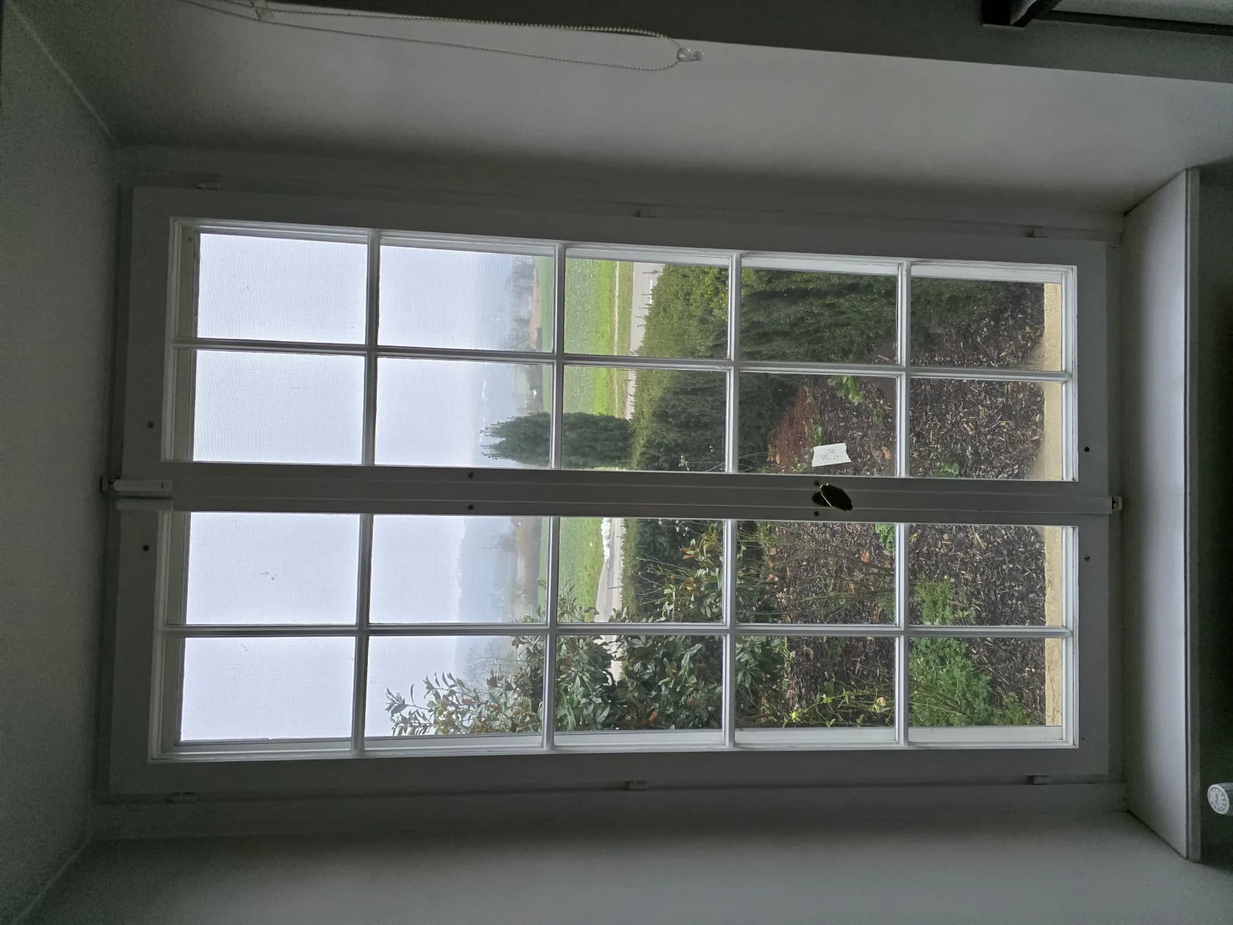 White two-sash glazing-bar window overlooking the garden