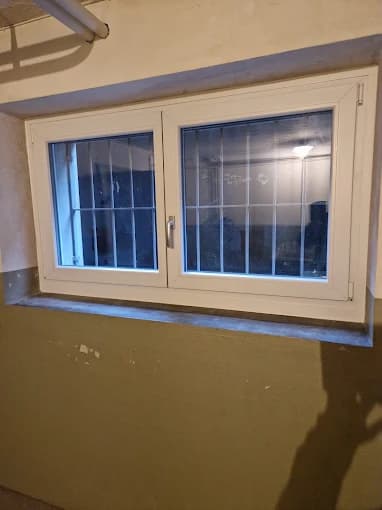 White two-sash glazing-bar window in a basement