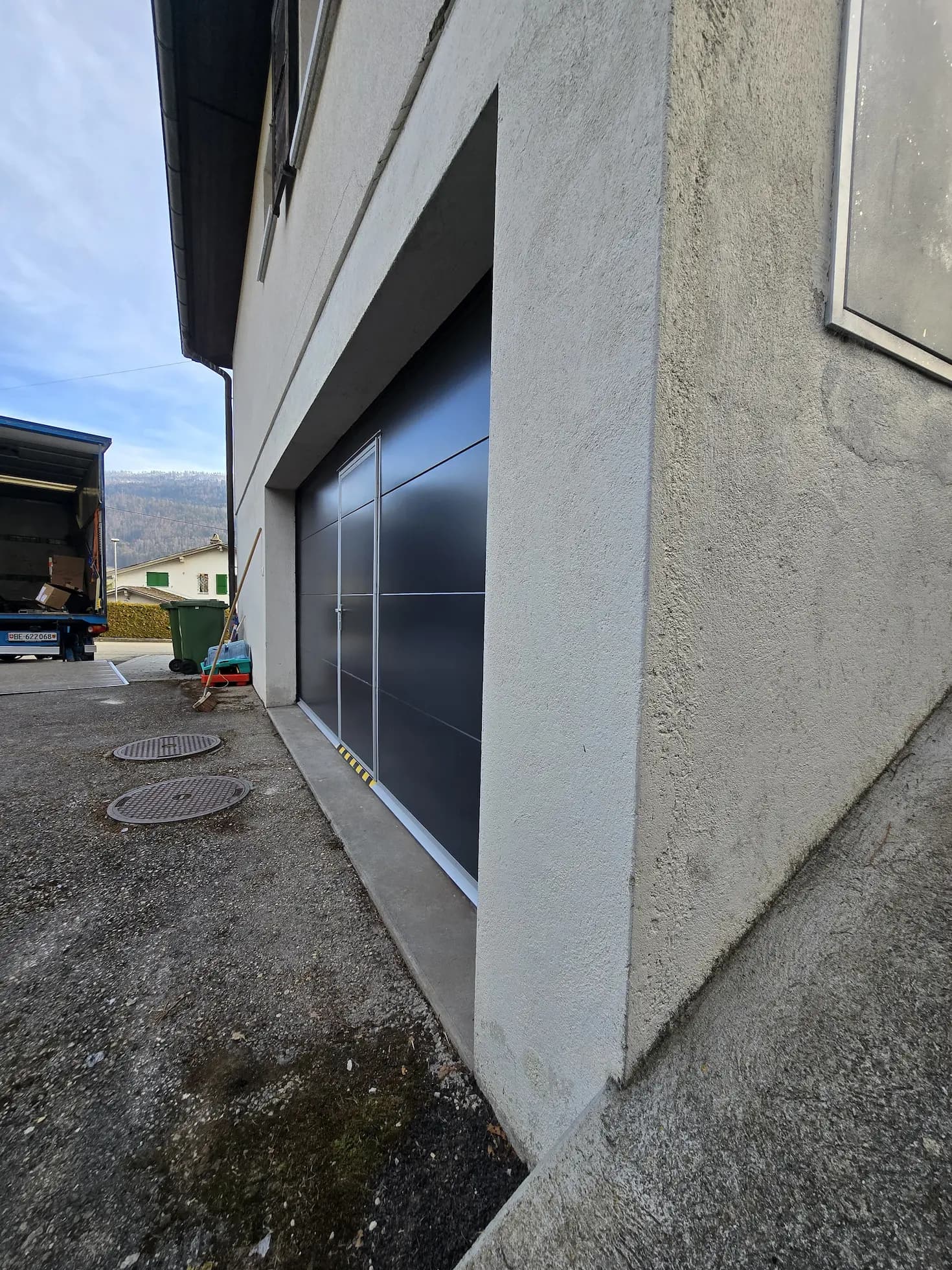 Anthracite garage door with integrated pedestrian door